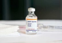 Deadly Outbreak Meets Mixed Messages MMR vaccine vial on a white surface