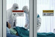One Flight Just Expanded a Deadly Outbreak’s Reach Healthcare workers in hazmat suits treat a patient in a quarantine room