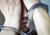 Horrifying Welfare Check Ends In Arrest Person in handcuffs covering face with hands