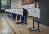 Citizenship Checks Axed – What’s Hidden Here? Voters at polling booths in a gymnasium