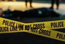 ICE Scapegoat? Case Takes a Dark Turn yellow police tape at a nighttime crime scene