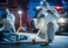 Chaos Erupts – Dozens Down, Killers Vanish forensic investigators at nighttime crime scene