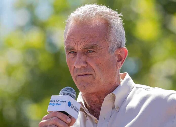 shutterstock_2346739537 Man speaking into a microphone outdoors