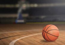 A basketball on a wooden court