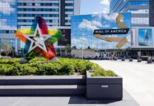 Terrifying Mall Plot Stopped Just In Time Mall entrance with colorful star sculpture and mirrored facade