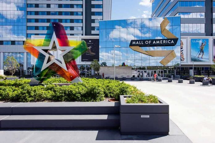 Mall entrance with colorful star sculpture and mirrored facade