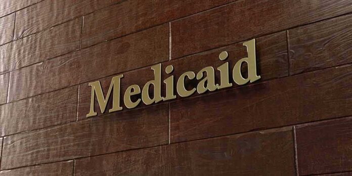 Medicaid sign on a brown wooden wall