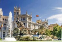 Monarchs Enter Flashpoint – Why Now? Cibeles Fountain with lions before ornate palace building